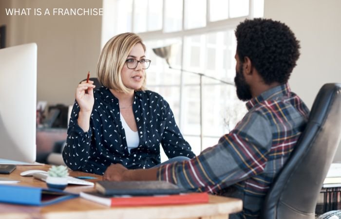 A women explain about franchise business Infront of man.